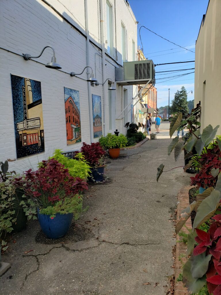 container gardens in a downtown alley between buildings