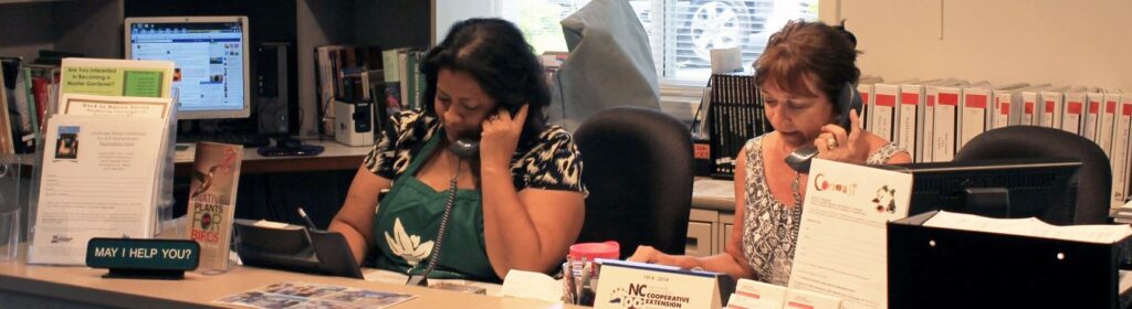 Volunteers answer phones at the New Hanover County Gardening Infoline.